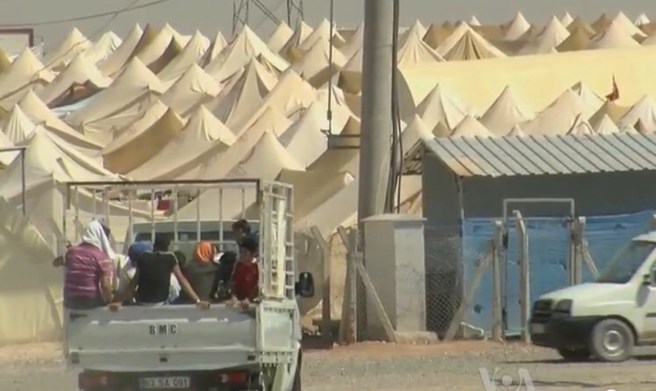 https://upload.wikimedia.org/wikipedia/commons/5/52/Syrian_refugee_camp_on_theTurkish_border.jpg