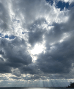 Dark clous with sunrays shining down