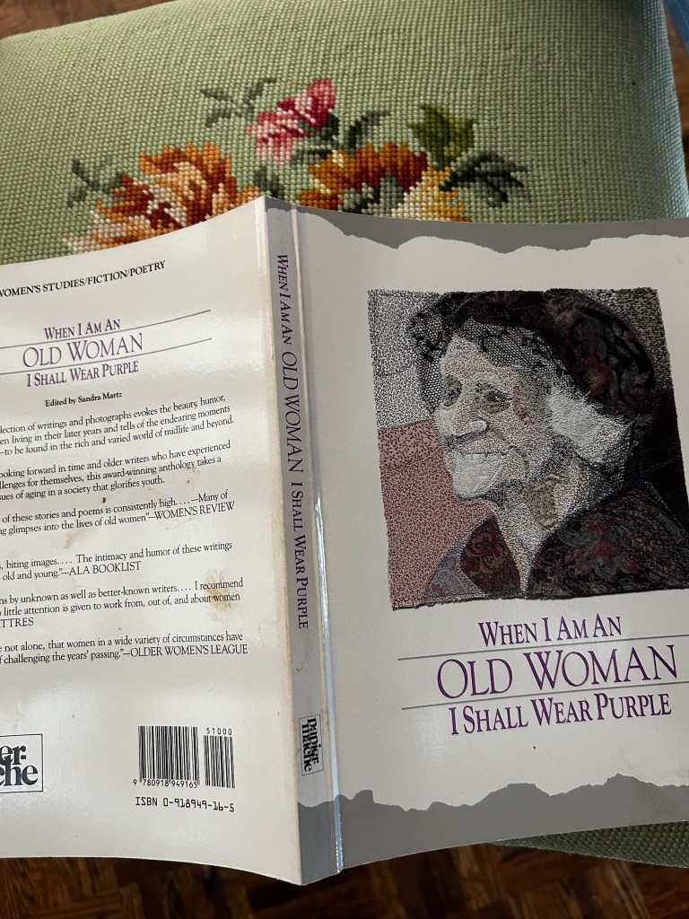 Book put down open on my mother's needlepoint chair seat